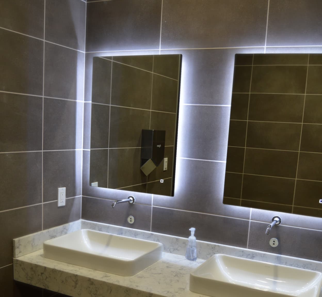 Adkisson Group reception with stone wall and custom desk