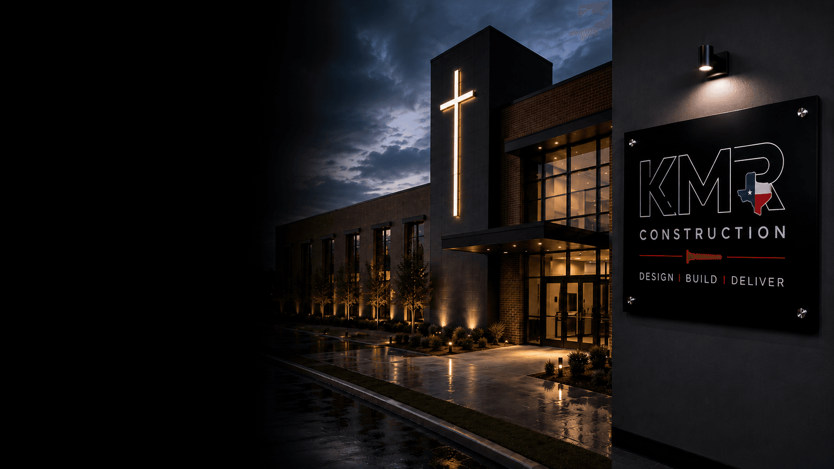 KMR-built church with illuminated cross, brick facade, and KMR signage at twilight